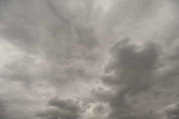 Swirling cloud formations build intense visual and atmospheric tension. Tumultuous sky with rotating central vortex creates striking cinematic and emotional impact © beholdereye