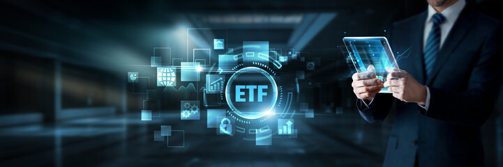 Fototapeta premium Businessman working on digital screen with ETF investments, data analytics and financial trading systems, portfolio diversification, market tracking, asset management, investment strategies