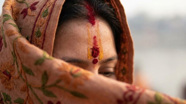 Close up of Indian woman with traditional Tilak on her forehead