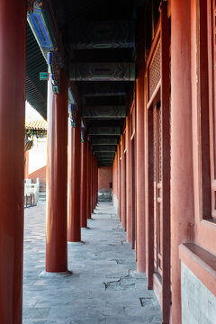 Corridor within Beijing China Forbidden City with pillars in red color