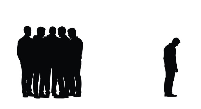 Silhouette of a lonely man standing apart from a group of people in total isolation