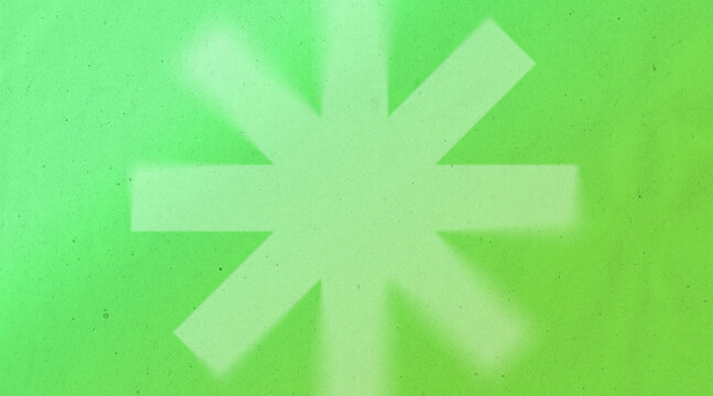 Vibrant green background featuring a large soft-edged asterisk symbol in the center with a subtle paper-like texture overlay