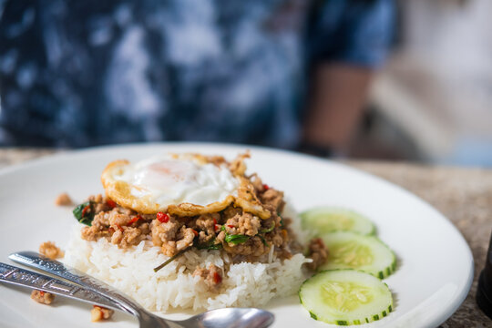 Thai food, stir-fried pork with basil and fried egg on rice