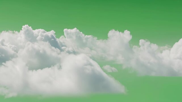 Fluffy white clouds against a vibrant green sky background