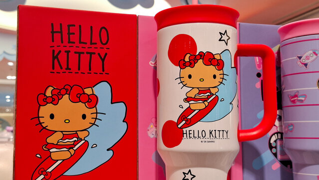 Close up of Hello Kitty character reusable travel mug and festive gift box featuring cute summer surfing theme design for hot and cold beverages on April 27, 2026 in Bangkok, Thailand