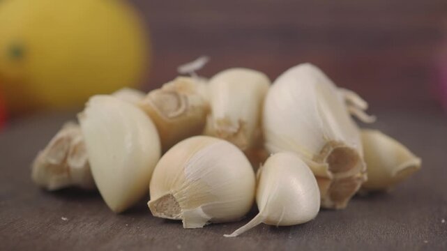 Cut garlic cloves for cooking in kitchen