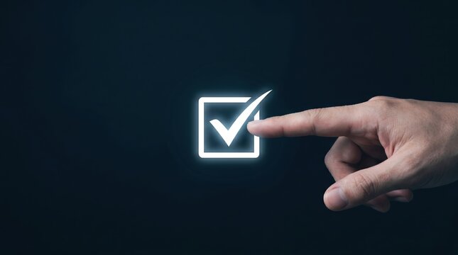 Finger touching glowing checkmark in square on dark background with checkmark touching pointing pressing interface