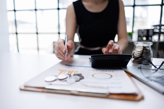 Woman calculating budget and finance for savings and investment