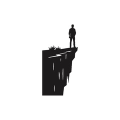 A man stands alone on a cliff edge overlooking landscape © Eko