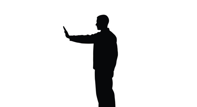 Silhouette of a man standing and pointing with his finger to the left side