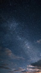 Obraz premium Starry Night Sky with Clouds and Milky Way Galaxy