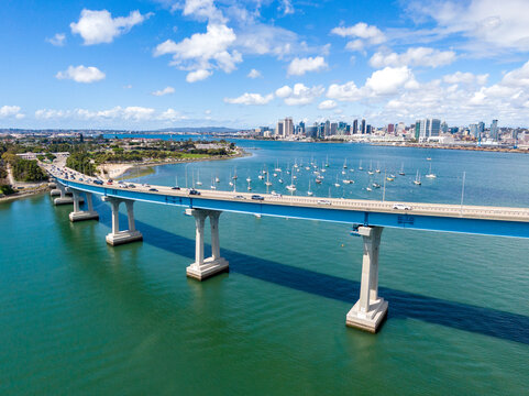 Aerial View Of Coronado Bridge And Golf Course With San Diego Skyline Background