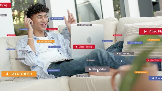 Vertical video: Seeing prompts man putting on headset tapping remote with laptop at home to play