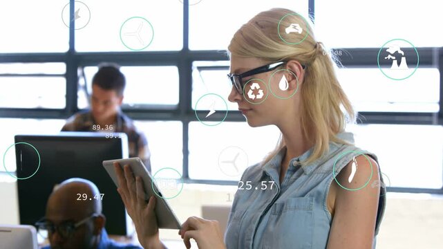 Camera moving up revealing woman tapping tablet and initiating overlay energy charts for business