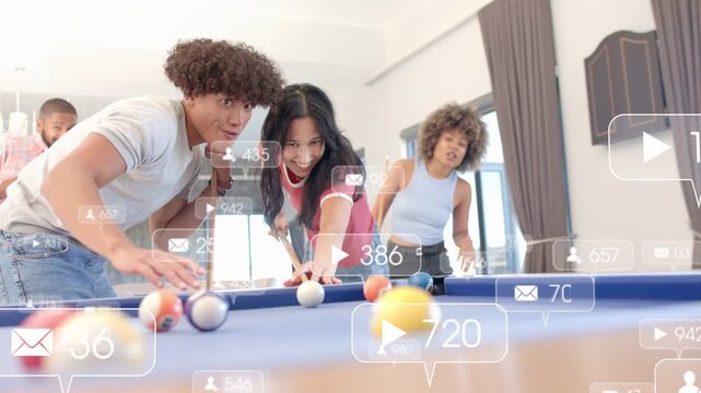 Center woman striking cue ball at blue-felt pool table, sharing live moment with rising counters