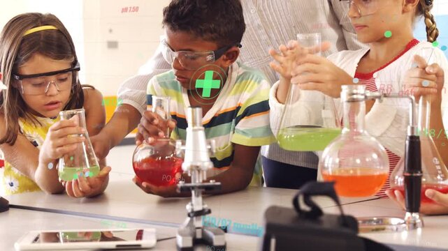Teacher leaning in guiding class mixing flasks, overlays showing liquid colors for science learning