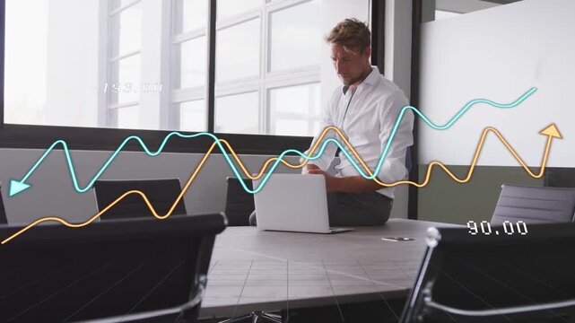 Man typing laptop at table, causing biz graphs crossing over him updating times standing reflecting