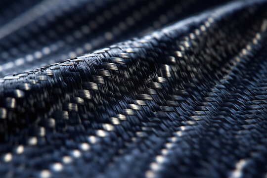 Black carbon fiber weave with silver metallic thread texture.