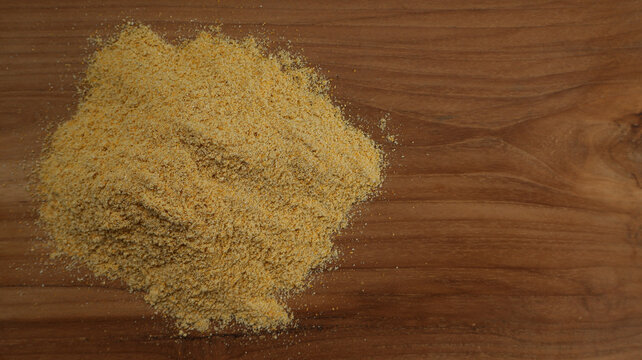 Top View of Corn Flour on Wooden Surface with Copy Space