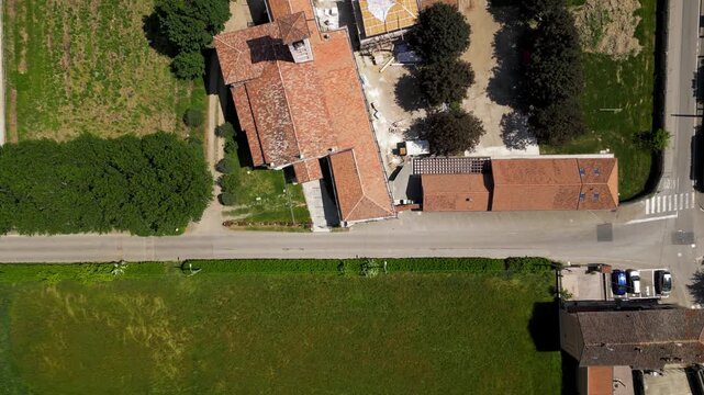 Aerial View of a Picturesque Rural Property: An overhead view showcases the unique architecture of a rustic building.