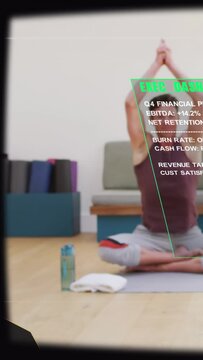 Vertical video: Phone starting AR finance dash moving over woman on mat in prayer pose showing Q4