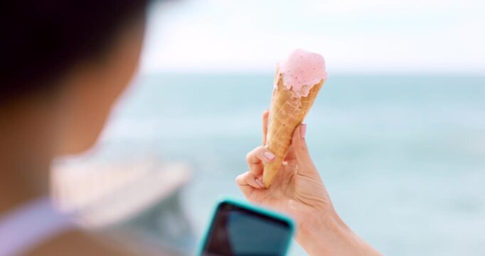 Ice cream, picture and hands with phone screen at beach, influencer and image for social media post. Ocean, content creation and people with mobile for dessert promotion, photo and digital marketing