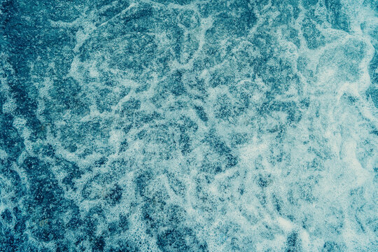 Powerful rushing water with white foam and liquid energy background