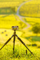 Naklejka premium Camera on tripod take picture from landscape in Pupillin commune, Jura wine region, Burgundy in France.