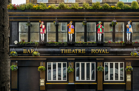 Theatre Royal Bar in Edinburgh, Scotland. The facade of this historic Victorian-style pub is known for its striking statues of herald-like pipers