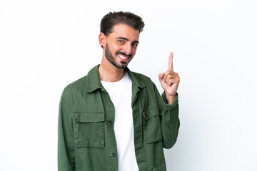 Fototapeta premium Young caucasian man isolated on white background showing and lifting a finger in sign of the best