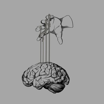 Human hand controlling a brain with strings like a puppet - manipulation concept.