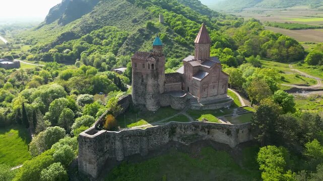 Aerial view of Gremi Monastery, a historic architectural complex in the Kakheti region, with surrounding landscape.