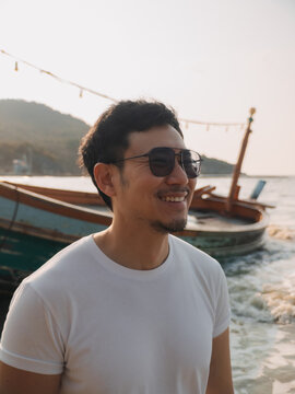 An individual wearing shades observes tranquil evening and scenic views