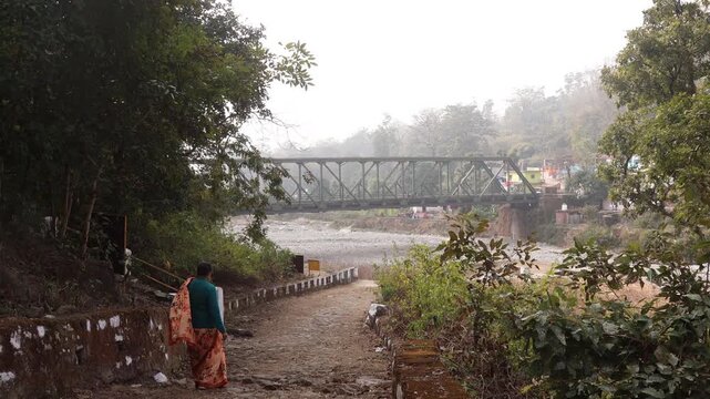 Raw 4K footage of bridge in Kotdwara Uttarakhand, sacred site of Rishi Kanva and birthplace of Bharat, surrounded by river Malini, forest, and spiritual heritage.