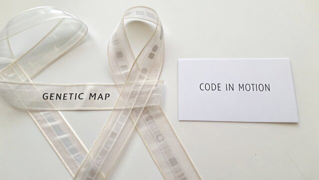 Transparent ribbon with code and map text on a white surface, isolated for design