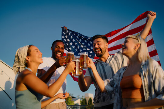 Diverse friends cheering beer celebrating usa independence day
