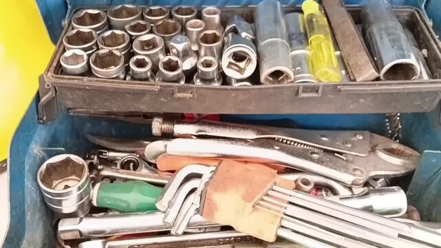 Camera Zooming Out from a Fully Equipped Mechanic Tool Box Revealing Industrial Maintenance Tools