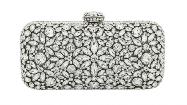 Rectangular evening clutch bag covered in sparkling clear crystals arranged in a symmetrical floral pattern on a black background