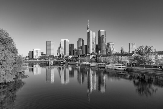 view to Frankfurt skyline with reflection of skyscraper in River Main