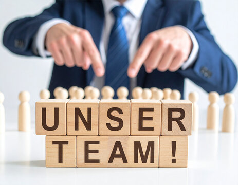 Unser Team! - Geschäftsmann zeigt auf den Text "Unser Team!"