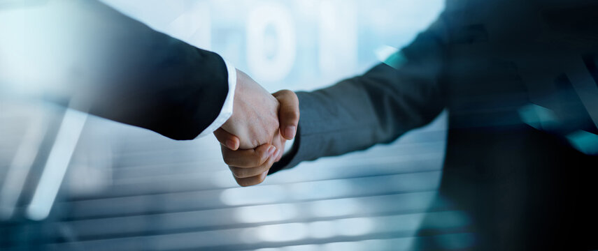 Businessman shake hand with partner to celebration partnership and business deal for business merger and acquisition, Business cooperation, Investment and finance, Successful business.