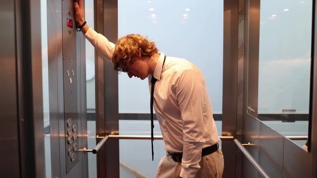 Tired office worker rides the elevator on the way to work showing morning fatigue low energy emotional strain and the quiet pressure of another demanding day