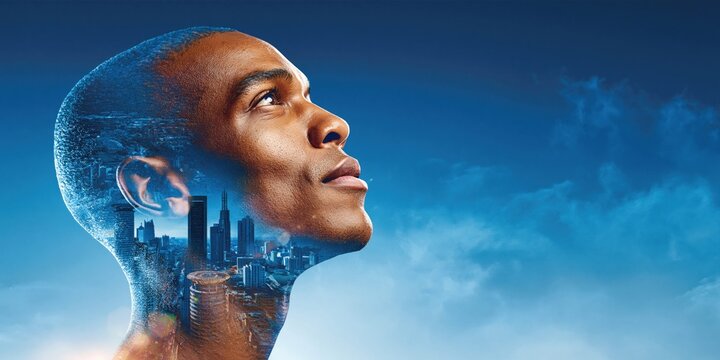 Double exposure of African man's head with cityscape and sky