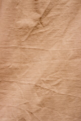 Obraz premium The surface of a pastel orange crew neck t-shirt.