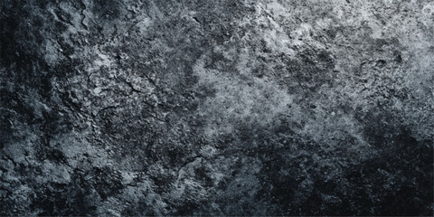 An abstract dark blue and black and white grunge texture captures a cold winter surface with macro details of rough stone and frozen ice patterns on a gray concrete backdrop © MDNUR