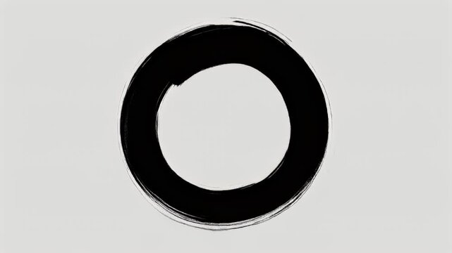 A close-up view of a black ring on a gray background