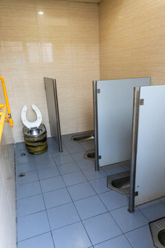 Public toilet in Beijing Hutong in cubicle but without doors. No privacy.