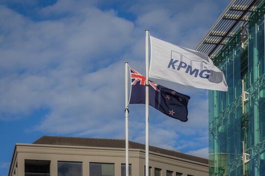 AUCKLAND, NEW ZEALAND &ndash; May 2, 2026: The KPMG flag flies next to the New Zealand flag in Auckland CBD. KPMG is a global professional services company.