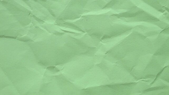 Soft mint green wrinkled paper texture animation. Seamless stop-motion loop for fresh, creative projects and gentle video backdrops.