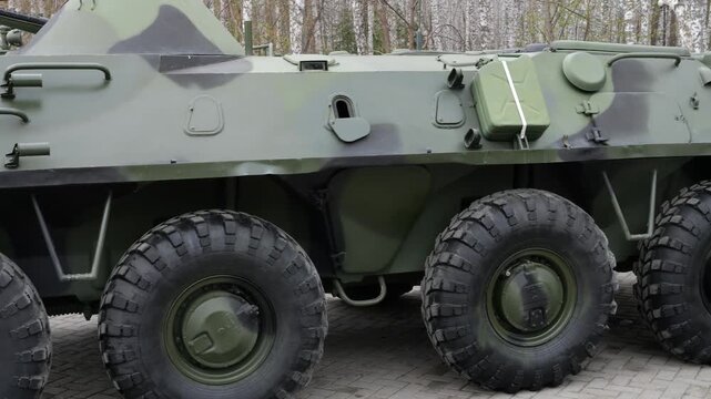 Green armored personnel carrier side view outdoors